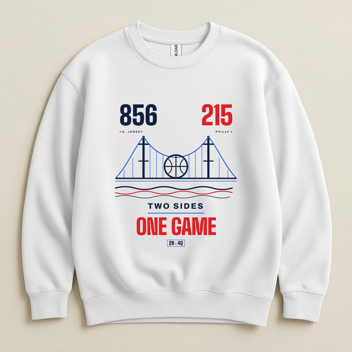 A white crewneck sweatshirt featuring a graphic print of bridging 856 South Jersey area code and 215 Philadelphia area code through one game, connecting both sides on a beige background. 